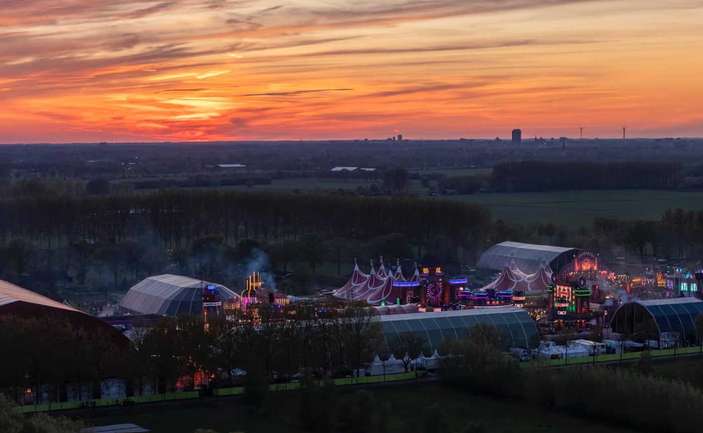 A music festival site at sunset