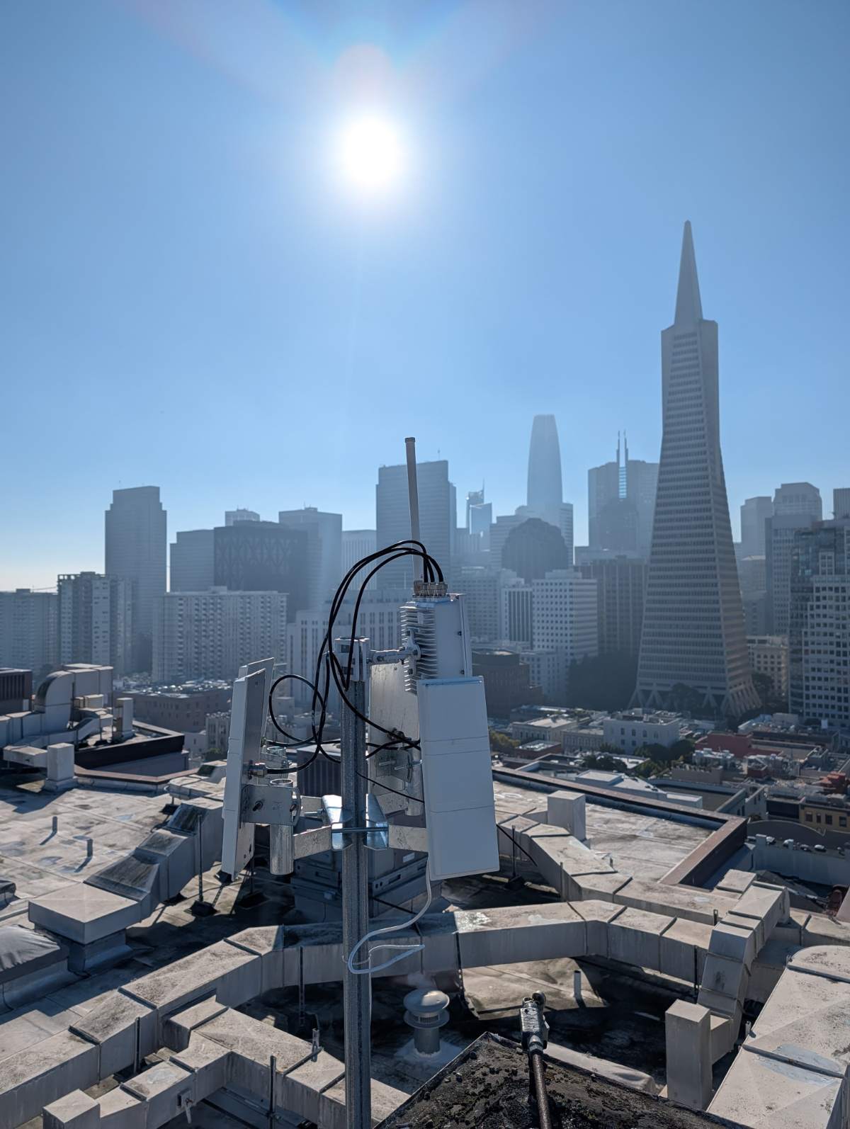 A drone-detection receiver on a San Francisco rooftop with the skyline behind it